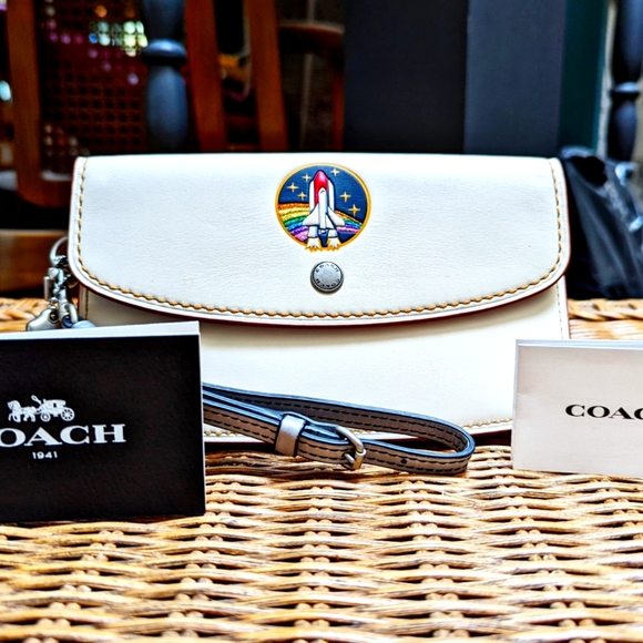 NWOT COACH 1941 CHALK/MULTI NASA SPACE SHUTTLE CLUTCH WRISTLET CROSSBODY 14049 - Picture 1 of 7